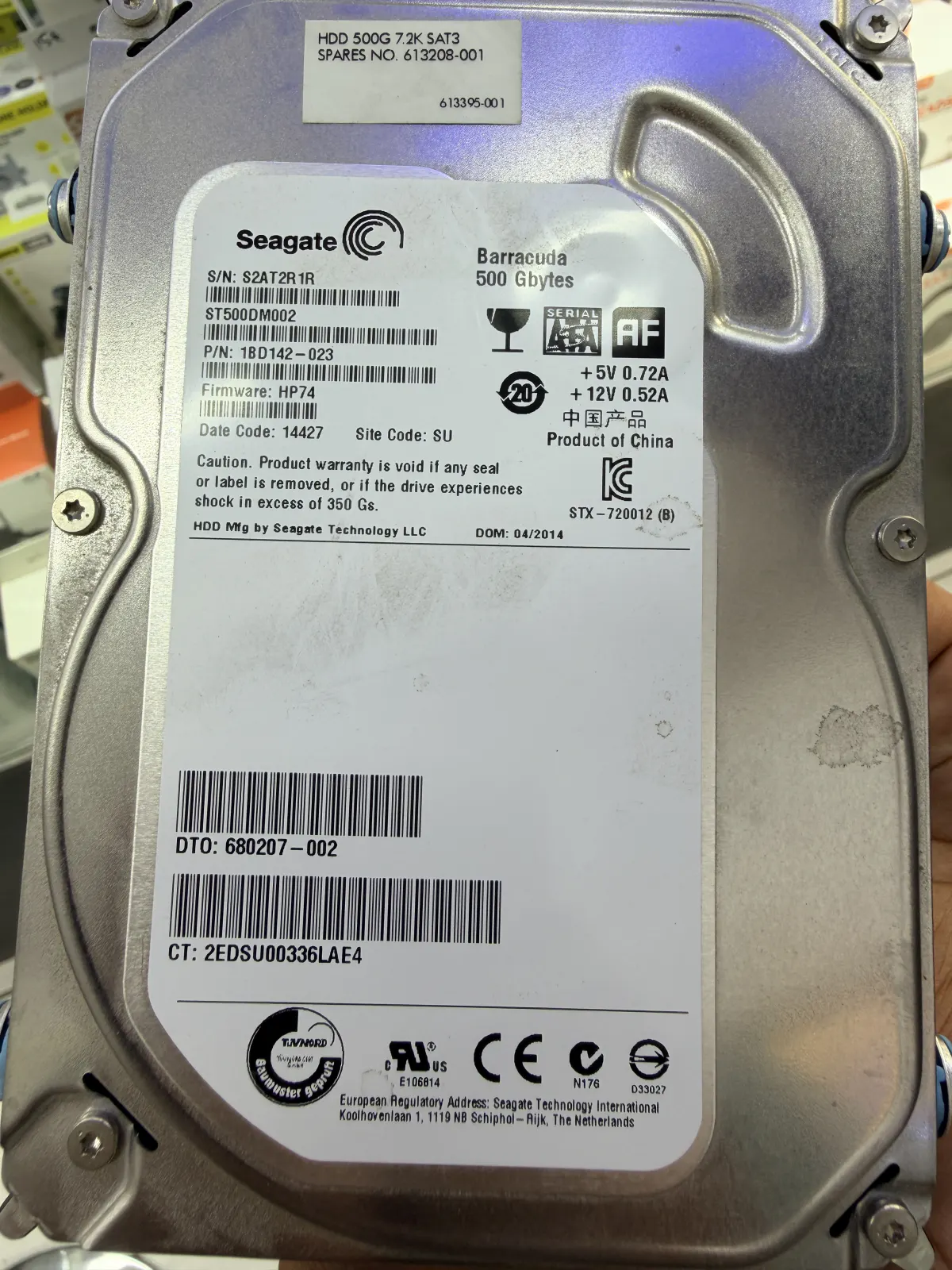 Close-up of a Seagate Barracuda 500GB hard drive label, model ST500DM002, photographed on my workbench